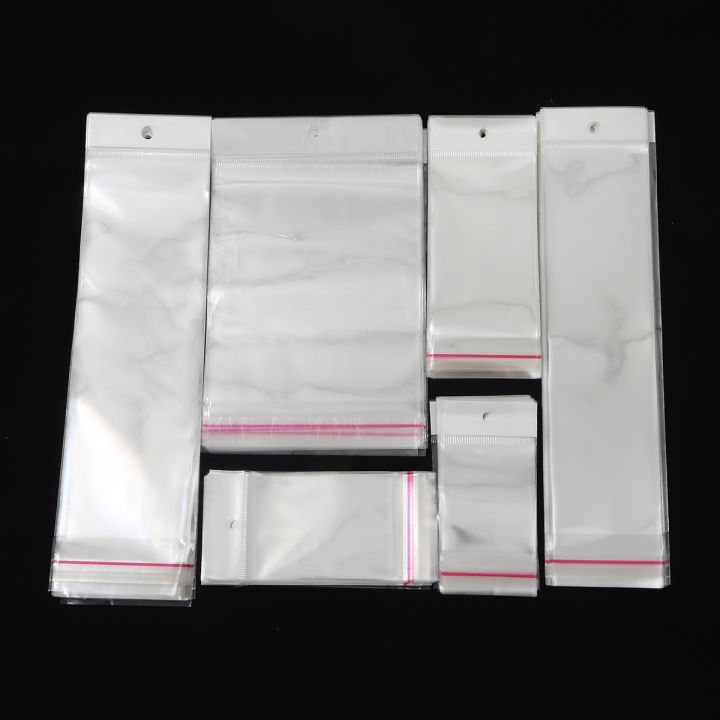 100PcsTransparent%20Self%20Adhesive%20Seal%20Plastic%20Storage%20Bag%20OPP%20Pack%20Bag%20With%20Hang%20Hole%20Retail%20Packaging%20Pouch%20-%20Image%204
