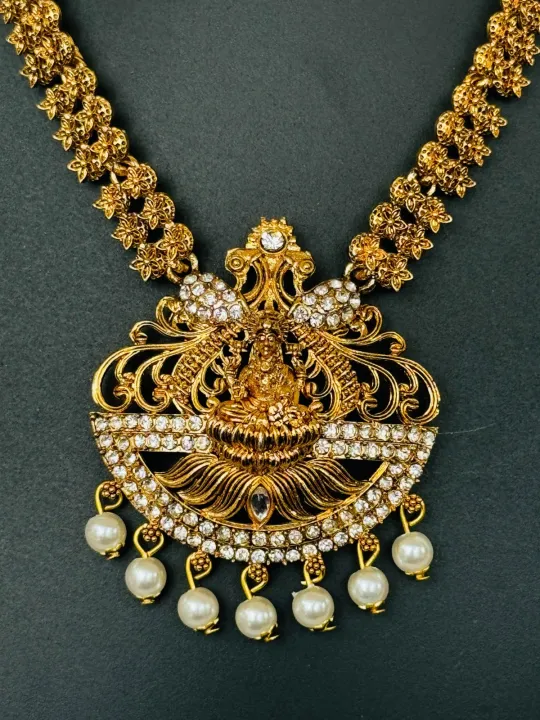 Gold%20color%20temple%20design%20long%20necklace%20set%20with%20silver%20color%20stone%20and%20off-white%20pearl%20for%20women%20and%20girl%20-%20Image%208