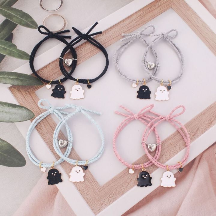 Trendy%20Black%20and%20White%20Halloween%20Couple%20Bracelets%20with%20Love%20Heart%20Pendant%20-%20Adjustable%20Rubber%20Band,%20Matching%20Set%20-%20Image%205