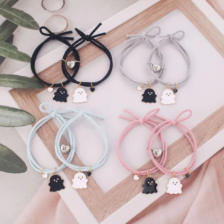 Trendy%20Black%20and%20White%20Halloween%20Couple%20Bracelets%20with%20Love%20Heart%20Pendant%20-%20Adjustable%20Rubber%20Band,%20Matching%20Set%20-%20Image%205
