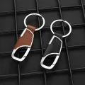 Luxury Leather + Zinc Alloy Men and Ladies Keychain Black Clasp Creative Keyring Holder Car Key Chain For Men Jewelry Gift. 