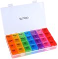 Four compartments daily pill organizer/storage multi colour. 