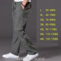 spring summer casual pants male big size 6XL Multi Pocket Jeans oversize Pants overalls elastic waist pants plus size men. 