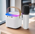 Compact Wireless Mini Karaoke Speaker System with Bluetooth, Microphone, and LED Effects, Ideal for Singing at Home or Outdoor Parties for All Ages. 