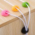 Data cable sorting device Desktop mobile phone data cable storage fixing seat clip Winding car Self-adhesive buckle mouse cable clamp Network sorting cable fixing device. 
