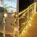 Auoyo 2M / 5M Fake Vines with 20 / 50 LED  Outdoor String Lights Artificial Plants Patio Decor Hanging Fake Ivy Greenery Garland Plants Fake Leaves For Balcony Decor / Outdoor Wall Decor / Garden Decor / Party. 