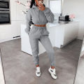 European and American women's sportswear two-piece casual sports set with exposed navel top and pants hooded shirt street set. 