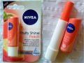 NIVEA Peach Shine Lip Care Delights Your Lips With Its Delicious Peach Aroma, A Fabulous Shimmer And Soft Glossy Colour (Npsl). 