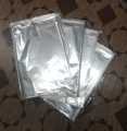 100pcs 9.5x12" Transparent Polythene T Shirt Packing Bag with Self Sticker. 