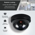 Realistic Looking Security Camera with Red LED Bulb. 