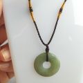 Jade circle pendant,  ကျောက်စိမ်း အဝိုင်းပုံဆွဲသီး၊. 
