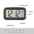 Smart Optical Control LCD Clock with Automatic Sensor Backlight, Snooze Alarm, Date and Temperature for Home and Office. 