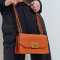 Charles & Keith -  Metallic Push-Lock Crossbody Bag - Orange. 