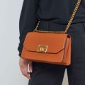 Charles & Keith -  Metallic Push-Lock Crossbody Bag - Orange. 