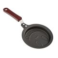 Smile-shaped nonstick pan. 