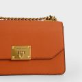 Charles & Keith -  Metallic Push-Lock Crossbody Bag - Orange. 