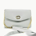 white coloured strap bag. 