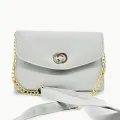 white coloured strap bag. 