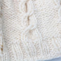 Cream Hand Woven Winter Woolen Cap For Girls. 