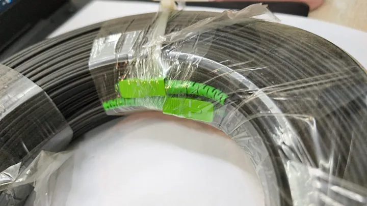 FIBER%20OPTIC%20PATCH%20CABLE%20DROP%20WIRE%20GREEN%20GREEN%20CONNECTOR%2050%20Meter%20LENGTH%20BLACK%20COLOUR%20WITH%20SUPPORT%20DROP%20WIRE%20SC/APC-SC/APC%20-%20Image%202
