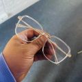 Elegant Women's Transparent Full Rim Eyeglasses with Clear Frame and Gold Accents. 