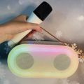 Mini karaoke machine with 2 wireless microphones and portable BT peakers. 