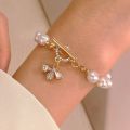 Enacolor Delicate Luxury Zircon Golden Metal Bee Shaped Pearl Bracelet for Women Chain Accessories 2024. 