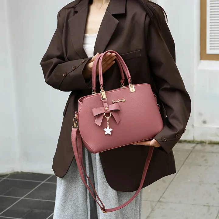 For%20everyday%20and%20party%20work,%20the%20handbag%20is%20stylish%20with%20multiple%20straps,%20an%20elegant%20shoulder%20bag%20with%20bow%20trims,%20compartments,%20fit,%20use%20-%20Image%205