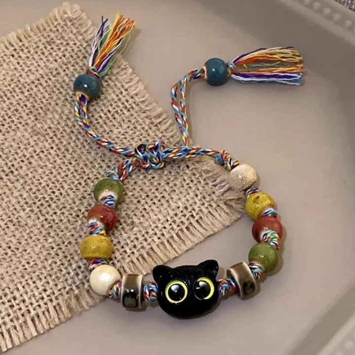Ceramic%20Big%20Eye%20Cat%20Bracelets%20Fashion%20Adjustable%20Size%20Tassels%20Braided%20Rope%20Bracelet%20Skull%20Accessories%20Hand%20Jewelry%20Creek%20-%20Image%204