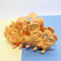 Yellow Hair Clamp. 