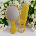 Handheld Fashionable Beauty Mirror With Comb (Color May Vary). 