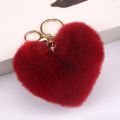 Fur ball key chain love car pom leopard print hair new heart shaped fluff ball keychain ladies bag pendant key ring jewelry. 