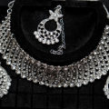 White Gold Plated AD Setting Floral Upper Hole Choker Set With Earring & Bindi. 