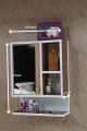 mini dressing table with mirror and door. 