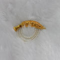 Gold khukuri brooch. 