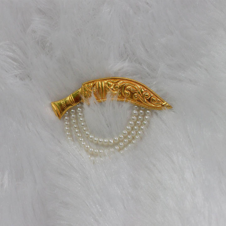 Gold khukuri brooch