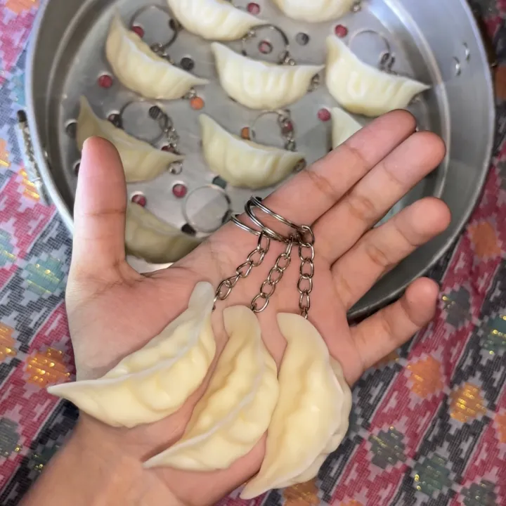 Mini%20Momo%20Dumpling%20Keyring%20%E2%80%93%20Cute%20Food-Themed%20Keychain,%20Acrylic/Resin%20Hanging%20Charm%20Accessory%20for%20Keys,%20Bags%20&%20Gifts%20%7C%20Momo%20Key%20Chain%20-%20Image%204