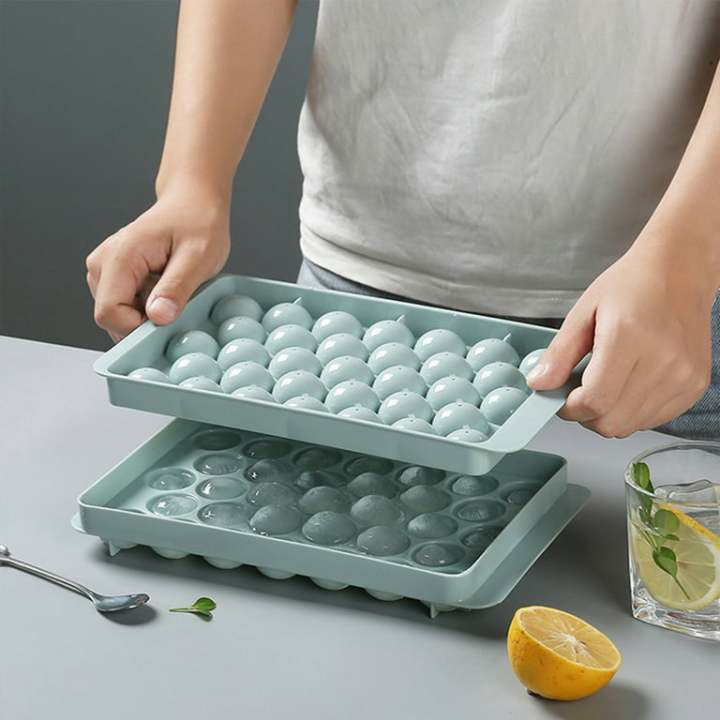 Round%20Ice%20Cube%20Tray%20with%20Lid%20&%20Bin%20Ice%20Ball%20Maker%20Mold%20for%20Freezer%20with%20Container%20Mini%20Circle%20Ice%20Cube%20Tray%20Making%2066PCS%20Sphere%20Chilling%20Cocktail%20Whiskey%20Tea%20Coffee%202%20Trays%201%20ice%20Bucket%20&%20Scoop%20-%20Image%204