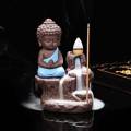 Handcrafted Meditating Little baby Monk Buddha Smoke Backflow Cone Incense Holder Decorative Showpiece - 12 cm  (Polyresin, Blue). 