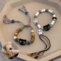 Ceramic Big Eye Cat Bracelets Fashion Adjustable Size Tassels Braided Rope Bracelet Skull Accessories Hand Jewelry Creek. 