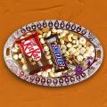 Mixed Dry Nuts With Chocolates In Ovel Tray. 