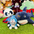 Adorable Stuffed Animal Trio: Shark, Superman Panda, and Doraemon Doll. 