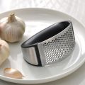 Stainless Steel Garlic Press: Efficient Kitchen Masher Tool. 