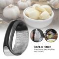 Stainless Steel Garlic Press: Efficient Kitchen Masher Tool. 
