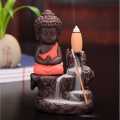 Handcrafted Meditating Little Baby Monk Buddha Smoke Backflow Cone Incense Holder Decorative Showpiece - 12 Cm (Polyresin, Multicolor). 