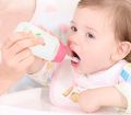 Baby Silicone Squeeze Feeding Bottle With Spoon. 