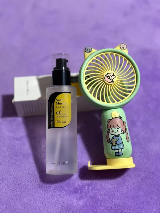 "Disaar%20Snail%20Mucin%20Essence%20Serum%20100ml:%20A%20Powerful%20Skincare%20Solution%20for%20Radiant%20and%20Healthy%20Skin"%20with%20small%20potable%20mini%20fan%20gift%20-%20Image%205