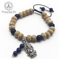 Nirvana Unisex Lotus Seed Wrist Mala/Bracelet With Lapis And Ganesh Charm. 