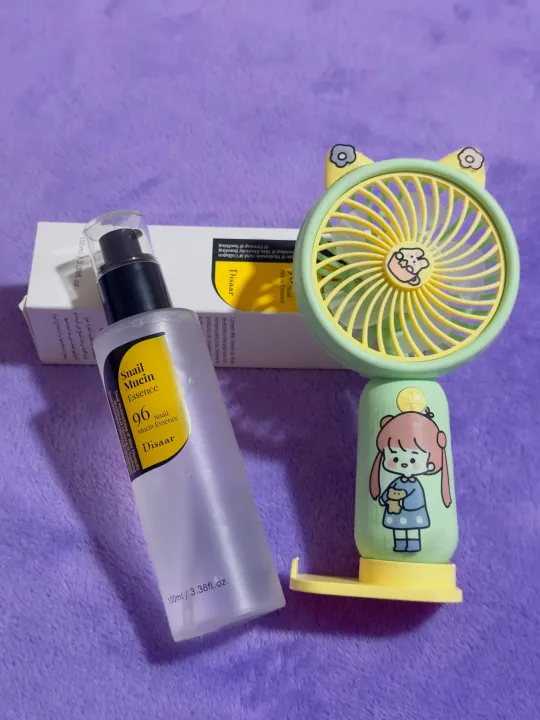 "Disaar%20Snail%20Mucin%20Essence%20Serum%20100ml:%20A%20Powerful%20Skincare%20Solution%20for%20Radiant%20and%20Healthy%20Skin"%20with%20small%20potable%20mini%20fan%20gift%20-%20Image%204