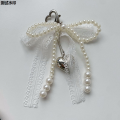 Country Y2K Beauty Car Keychain Han Sweet Pearl Bow Ladies Keychain 2025新品，Jinnikaiji Heart Shaped Lace Pendant Bag Pendant Accessories 2025 New Gifts. 